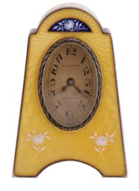 Eterna Watch Co., Switzerland, desk or bedside clock, silver gilt case with yellow guilloche enamel and floral ornament, Arabic numeral, oval silvered dial, blued steel hands, 8 day, 15 jewel timepiece movement with lever escapement