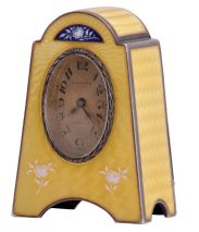 Eterna Watch Co., Switzerland, desk or bedside clock, silver gilt case with yellow guilloche enamel and floral ornament, Arabic numeral, oval silvered dial, blued steel hands, 8 day, 15 jewel timepiece movement with lever escapement