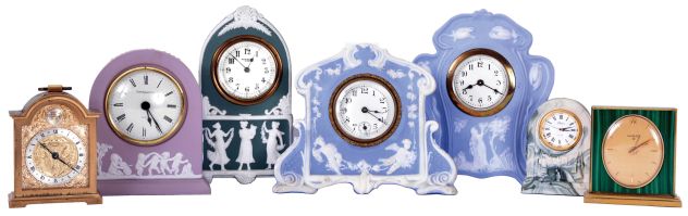 Clocks- 7 (Seven): Four with decorated jasper cases, one marked "Wedgwood", a "Luxor" with faux malachite case, an "Aynsley" with marbled Portlandware case, and a "Swiza" alarm in bracket clock form, mechanical and quartz movements, 20th century