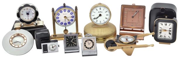 Clocks- 10 (Ten): including a "Tiffany & Co." travel alarm with outer case, an "Oberon" with wheelbarrow form case, a "LeCoultre" travel alarm with folding case, a "Sheffield" travel alarm with outer case, a "Stowa" travel alarm with outer case, two folding purse watches, and others