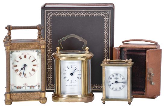 Carriage clocks- 3 (Three): including a "Matthew Norman" with oval case and original outer box, another with gilt case and decorative white enamel dial, and a Waterbury miniature with outer case