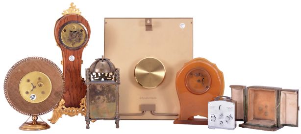 Clocks- 6 (Six): including an Ansonia miniature tall clock, a "Smiths" miniature lantern clock, a "Bayard - Luxe" travel alarm with outer case, a Bulova Swiss picture frame clock, and two others, mechanical and electric movements