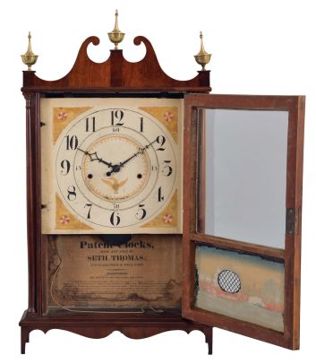 Seth Thomas, Plymouth, Conn., "Off Center Pillar and Scroll" clock with a weight driven 30 hour time and strike wooden movement in a mahogany veneered case.