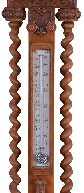 T. Boxell, Brighton, an ornately carved softwood barometer, the base with "green man" mask, trimmed with foliate ornament, beneath a shelf with barley twist columns flanking a thermometer with engraved reamur and fahrenheit scales, the top with engraved barometer scales surrounded by carved trim, and surmounted with a large, removable top carved with scallop shell, fruit and leaves