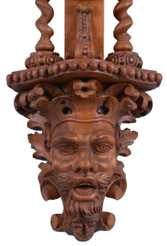 T. Boxell, Brighton, an ornately carved softwood barometer, the base with "green man" mask, trimmed with foliate ornament, beneath a shelf with barley twist columns flanking a thermometer with engraved reamur and fahrenheit scales, the top with engraved barometer scales surrounded by carved trim, and surmounted with a large, removable top carved with scallop shell, fruit and leaves