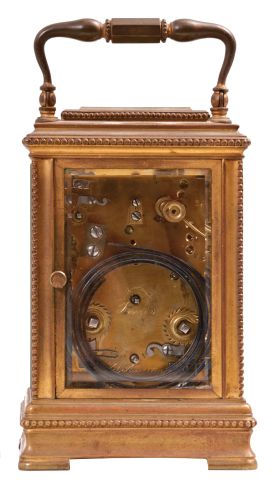 France for Bailey, Banks & Biddle, Philadelphia, Penn., carriage clock, 8 day, time and petite sonnerie with alarm, lever escapement, repeat button sounding the last hour and quarter, all in a gilt brass case with beveled front, side, back, and top glasses, white enamel dials.