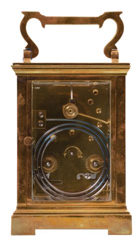 France, carriage clock, 8 day, time and strike, spring-driven movement with a lever escapement in an polished brass Anglaise case with five beveled glasses, white enamel dial, and blued steel hands, all in a leather carrying case.