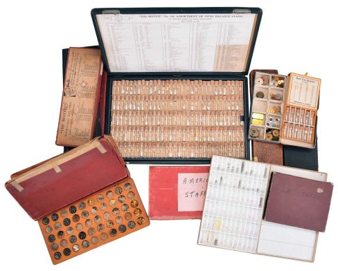 Wrist and pocket watch parts, three large boxes filled with material assortments from various manufacturers, including jewels, staffs, stems, crowns, gaskets, and more, for both Swiss and American watches, together with a box and a metal cabinet each containing hundreds of pocket watch crystals, and a wood pocket watch display case with glass door.