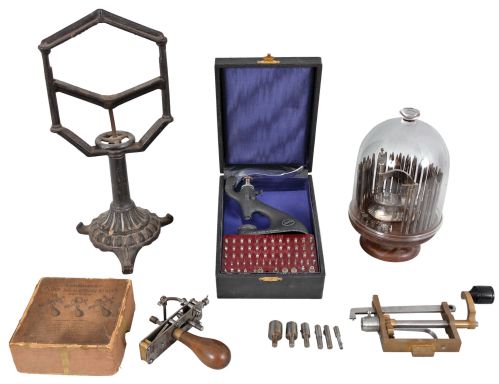 Tools- 5 (Five) Watch and Clock Tools: (1) Seitz, Switzerland, jeweling tool set in box; (2) E. Rivett, Boston, staking tools set on turned wood base under glass dome, 1890 patent dates; (3) Cast iron movement holder suitable for round French movements; (4) Vaughan