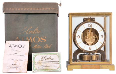 Jaeger-LeCoultre, Switzerland, "Atmos" clock, 15 jewel, caliber 526-5 movement, torsion pendulum movement with round metal dial, applied gilt arrow markers and numbers, gilt hands, in a glazed rectangular case with hinged font door, original cloth-covered box, serial #106500.