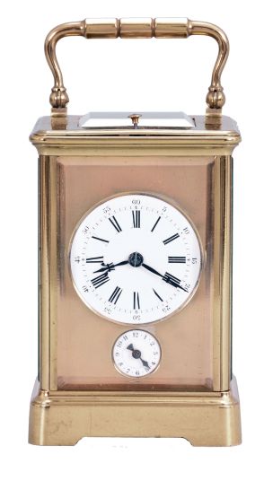 France, a petite sonnerie striking carriage clock with grand sonnerie repeating, polished brass Corniche case with bevelled glasses, the top engraved "J. K. Connally, Oct. 7, 1897", Roman numeral white enamel dial with gilt mask and subsidiary alarm dial, blued steel hands, 8 day, time, strike and alarm movement with lever platform, sounding the quarters in passing, and repeating the last hour and quarter on demand