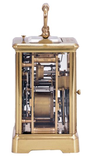 France, a petite sonnerie striking carriage clock with grand sonnerie repeating, polished brass Corniche case with bevelled glasses, the top engraved "J. K. Connally, Oct. 7, 1897", Roman numeral white enamel dial with gilt mask and subsidiary alarm dial, blued steel hands, 8 day, time, strike and alarm movement with lever platform, sounding the quarters in passing, and repeating the last hour and quarter on demand