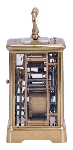 France, a petite sonnerie striking carriage clock with grand sonnerie repeating, polished brass Corniche case with bevelled glasses, the top engraved "J. K. Connally, Oct. 7, 1897", Roman numeral white enamel dial with gilt mask and subsidiary alarm dial, blued steel hands, 8 day, time, strike and alarm movement with lever platform, sounding the quarters in passing, and repeating the last hour and quarter on demand