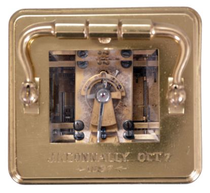 France, a petite sonnerie striking carriage clock with grand sonnerie repeating, polished brass Corniche case with bevelled glasses, the top engraved "J. K. Connally, Oct. 7, 1897", Roman numeral white enamel dial with gilt mask and subsidiary alarm dial, blued steel hands, 8 day, time, strike and alarm movement with lever platform, sounding the quarters in passing, and repeating the last hour and quarter on demand