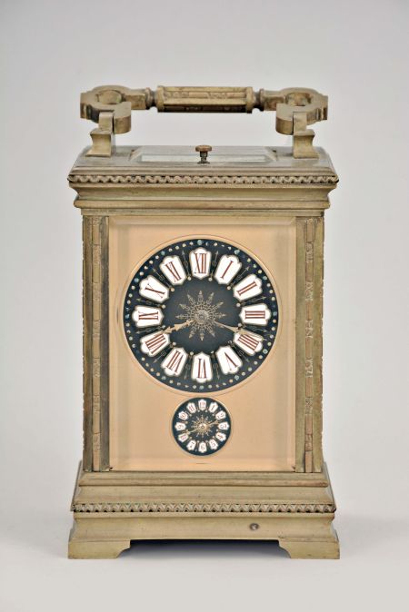 France, for the German market, hour repeating carriage clock with alarm, Anglaise variant case with beveled glasses, Roman numeral black enamel dial with integral white cartouches, gilt mask, and subsidiary alarm dial, gilt distaff hands, 8 day, time, strike, and alarm movement with lever platform and cut, bimetallic balance, sounding the hour and half hour in passing, and repeating the last hour on demand