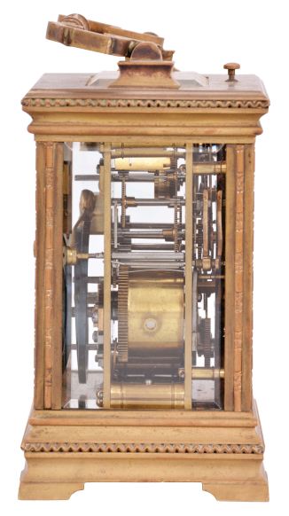 France, for the German market, hour repeating carriage clock with alarm, Anglaise variant case with beveled glasses, Roman numeral black enamel dial with integral white cartouches, gilt mask, and subsidiary alarm dial, gilt distaff hands, 8 day, time, strike, and alarm movement with lever platform and cut, bimetallic balance, sounding the hour and half hour in passing, and repeating the last hour on demand