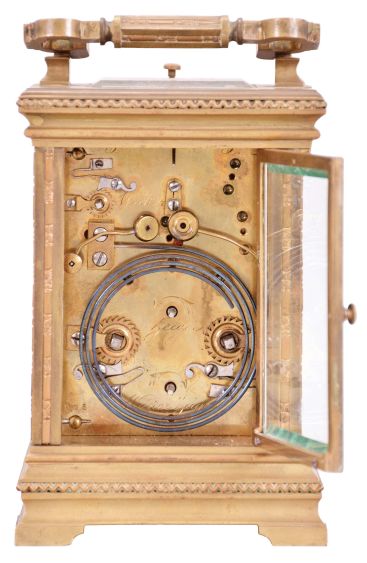 France, for the German market, hour repeating carriage clock with alarm, Anglaise variant case with beveled glasses, Roman numeral black enamel dial with integral white cartouches, gilt mask, and subsidiary alarm dial, gilt distaff hands, 8 day, time, strike, and alarm movement with lever platform and cut, bimetallic balance, sounding the hour and half hour in passing, and repeating the last hour on demand