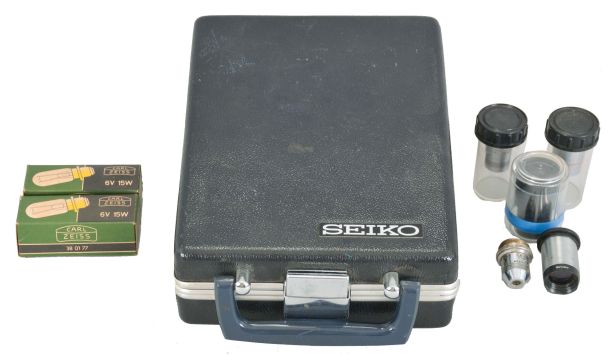 Seiko "Crystal Chronometer" with case, five microscope objective lenses, and two low voltage lamps