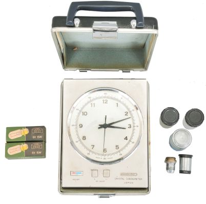 Seiko "Crystal Chronometer" with case, five microscope objective lenses, and two low voltage lamps