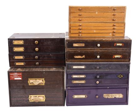 Watch Parts: lot includes 5 metal and wood cabinets with drawers which contain watch parts, most for pocket watches. Parts include hands, stems, balance wheels, crystals, crowns, sleeves, mainsprings, and more.