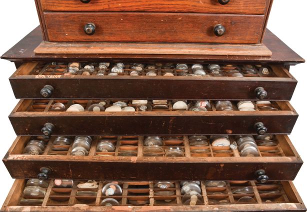 Watch Parts: lot includes 5 metal and wood cabinets with drawers which contain watch parts, most for pocket watches. Parts include hands, stems, balance wheels, crystals, crowns, sleeves, mainsprings, and more.