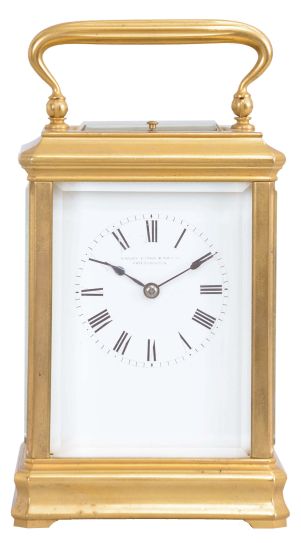 France, for Bailey, Banks, and Biddle, Philadelphia, a gilt, Cannelee variant cased hour repeating carriage clock, the glazed case with molded base and cornice, top with carrying handle, Roman numeral white enamel dial, blued steel spade hands, 8 day, two train movement with lever platform, striking the hours and half hour in passing, and repeating the last hour on demand