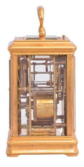 France, for Bailey, Banks, and Biddle, Philadelphia, a gilt, Cannelee variant cased hour repeating carriage clock, the glazed case with molded base and cornice, top with carrying handle, Roman numeral white enamel dial, blued steel spade hands, 8 day, two train movement with lever platform, striking the hours and half hour in passing, and repeating the last hour on demand