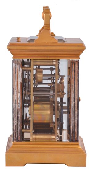 France, for George C. Shreve & Co., San Francisco, a gilt and silvered, hour repeating carriage clock, the architectural case with stepped, molded base and cornice, five beveled glasses, roman numeral gilt dial with Arabic alarm chapter, blued steel distaff hands, 8 day, three train movement with lever platform, striking the hour and half hour in passing, and repeating the last hour on demand