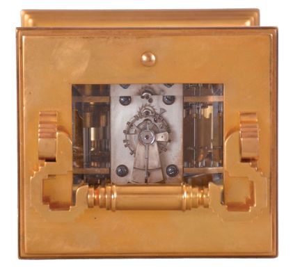 France, for George C. Shreve & Co., San Francisco, a gilt and silvered, hour repeating carriage clock, the architectural case with stepped, molded base and cornice, five beveled glasses, roman numeral gilt dial with Arabic alarm chapter, blued steel distaff hands, 8 day, three train movement with lever platform, striking the hour and half hour in passing, and repeating the last hour on demand