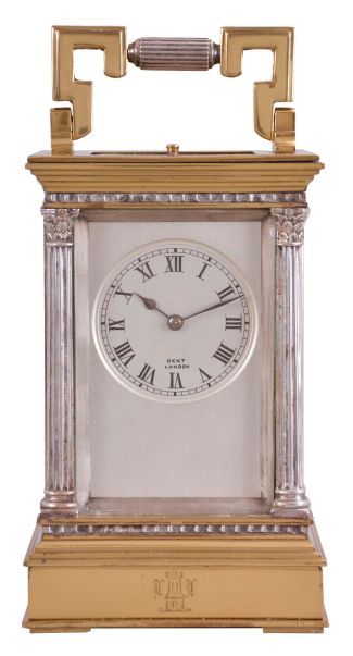 France, a gilt and silvered, Anglaise Riche cased hour repeating carriage clock, the architectural case with stepped, molded base and cornice, the corners with Corinthian columns, solid back with shutter for winding and setting apertures, and top with carrying handle, roman numeral silvered dial signed "Dent London", blued steel spade and poker hands, 8 day, two train movement with lever platform, striking the hours and half hour in passing, and repeating the last hour on demand