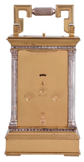 France, a gilt and silvered, Anglaise Riche cased hour repeating carriage clock, the architectural case with stepped, molded base and cornice, the corners with Corinthian columns, solid back with shutter for winding and setting apertures, and top with carrying handle, roman numeral silvered dial signed "Dent London", blued steel spade and poker hands, 8 day, two train movement with lever platform, striking the hours and half hour in passing, and repeating the last hour on demand