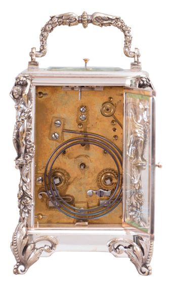 France, a silvered, Caryatides cased hour repeating carriage clock, the case with foliate ornamented scroll feet, the corners with floral drops supporting female figures, and handle with floral and foliate ornament, roman numeral silvered dial, blued steel spade hands, 8 day, two train movement with lever platform, striking the hours and half hour in passing, and repeating the last hour on demand