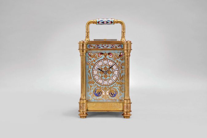 France, an unusual, champlevé enamel decorated, pillars style hour repeating carriage clock, the gilt case with outset corners, turned feet and columns, the base, frieze, and top with scrolling foliate designs, and decorated with polychrome enamel colors on a turquoise ground, the front of base with engraved presentation "Sir Donald Currie, K.C.M.G., M.P. In Remembrance of a Pleasant Cruise in the Pembroke Castle, Septr. 1883, from J.C.", Arabic numeral champlevé enamel dial with fine engraving and matching the exterior colors, blued steel distaff hands, two train movement with lever platform, striking the hours and half hour in passing, and repeating the last hour on demand