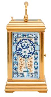 France, attributed to Gaye, Lamaille, & Co., a fine, Aesthetic Movement, porcelain paneled hour repeating carriage clock, the gilt, Cannelee variant case with folding handle, the sides set with panels depicting a potted flower in blue, on a cream ground, also with floral ornament, and with blue, wheatear border, the Arabic numeral dial with ornament matching the side panels, blued steel spade and whip hands, two train, 8 day movement with lever platform, striking the hour and half hour in passing, and repeating the last hour on demand, the back plate marked "Patent Surety Roller", and 1813