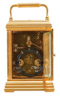 France, attributed to Gaye, Lamaille, & Co., a fine, Aesthetic Movement, porcelain paneled hour repeating carriage clock, the gilt, Cannelee variant case with folding handle, the sides set with panels depicting a potted flower in blue, on a cream ground, also with floral ornament, and with blue, wheatear border, the Arabic numeral dial with ornament matching the side panels, blued steel spade and whip hands, two train, 8 day movement with lever platform, striking the hour and half hour in passing, and repeating the last hour on demand, the back plate marked "Patent Surety Roller", and 1813