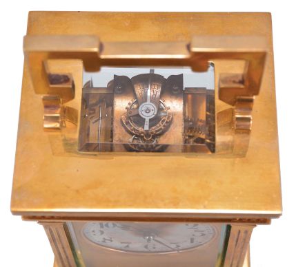 France, carriage clock, 8 day, time and strike counting the hours on a gong, spring driven movement with lever platform in an Anglaise case with fluted pilasters and and set with beveled glasses, gilt mask reading in part "Mappin & Webb Ltd. / 172 Regent St." surrounding a silvered dial with Arabic numerals, blued steel hands.