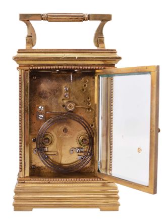 France, carriage clock, 8 day, time and strike counting the hours on a gong, spring driven movement with lever platform in an Anglaise case with stepped and molded base, edge beading and glazed on five sides with beveled glass, white enamel dial with Roman numerals for the hours and Arabic numerals for the minutes, blued steel distaff style hands.