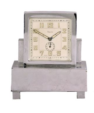 Renova, Switzerland, a nickel plated, musical alarm clock in a rectilinear case with Arabic numeral metal dial, blued steel luminous baton hands, 30 hour, timepiece movement with music box concealed in the base