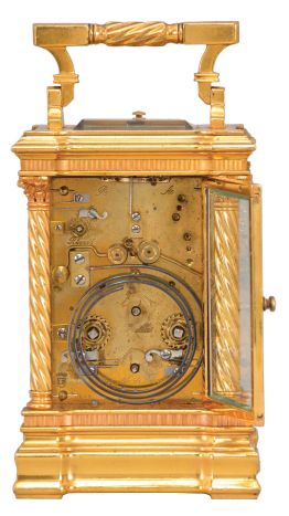 France, a good hour repeating, Anglaise Riche variant carriage clock with alarm, the gilt case with molded base and fluted band supporting twisted columns with Corinthian capitals, the entablature with fluted band, and stepped, molded cornice, case top with folding handle, roman numeral white enamel dial, blued steel distaff hands, three train movement with lever platform, sounding the hour and half hour in passing, and repeating the last hour on demand