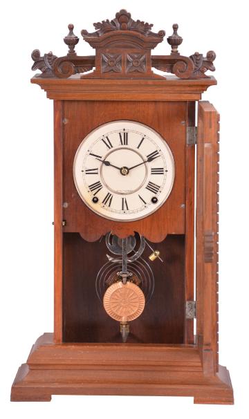 Seth Thomas Clock Co., Thomaston, Conn., "Utica" city series shelf clock with a spring driven, 8 day, time and strike (cathedral gong) movement in a walnut case.