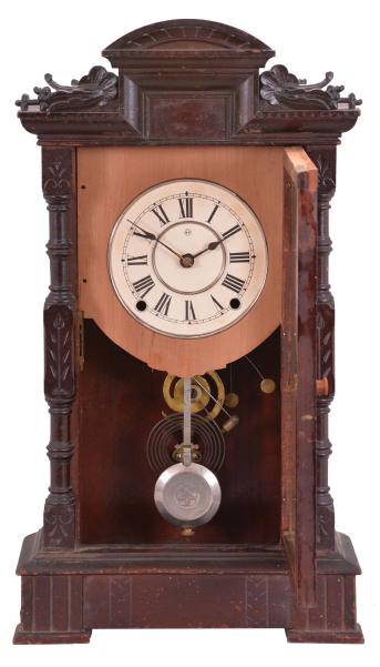 Seth Thomas Clock Co., Thomaston, Conn., "Hecla" shelf clock with a spring driven time and quarter strike movement in a walnut case.