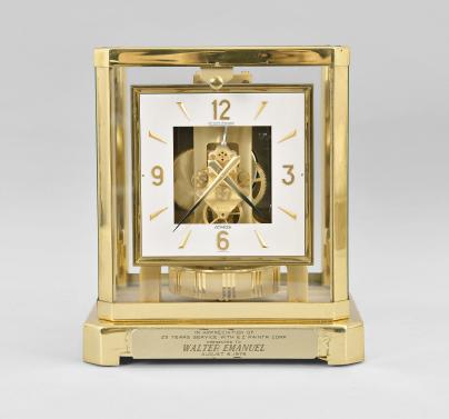 Jaeger-LeCoultre, Switzerland, "Atmos" clock, caliber 528, 15 jewel movement, gilt torsion pendulum, square white dial with applied gilt arabic numerals and arrow markers, gilt hands, all within a glazed rectangular case with removable front panel, serial number 434180.