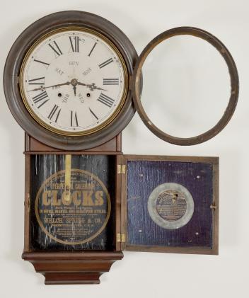 Welch, Spring & Co., Forestville, Conn., "Round Head Regulator No. 4" wall clock with a spring driven 8 day time and strike movement and a B. B. Lewis patented perpetual calendar mechanism in a rosewood veneered case.