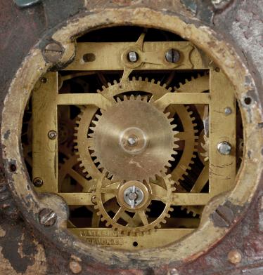 Waterbury Clock Co., "Sambo" blinking eye novelty clock, 30 hour, spring driven balance wheel movement with linkage to animate eyes in a painted cast iron case depicting a man with a banjo, roman numeral paper dial with blackened steel spade hands.