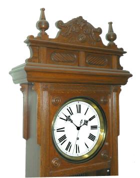 Waterbury Clock Co., Waterbury, Conn., "Regulator No. 60" hanging clock, 8 day, time only, weight driven movement with Graham deadbeat escapement and sweep seconds, meter-long lyre pendulum with oval rods in an oak case with a roman numeral white enamel dial, and pierced steel hands.
