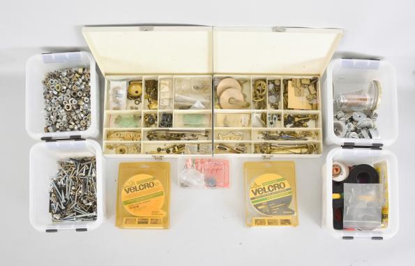 Parts- 6 (Six) boxes of clock parts including many mainsprings, dozens of keys, verges, cables & cord, fasteners, clock oil, wall hooks, gongs, many antique cast metal case parts, and more, together with a group of American and Swiss watch movements, crowns, and wrist watches.