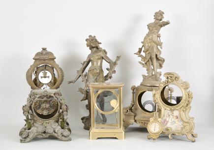 Clock parts- 8 (Eight) clock case, most for Ansonia figurals including a "Don Caesar and Don Juan" with movement, cast spelter figures, and two other clock cases with movements.