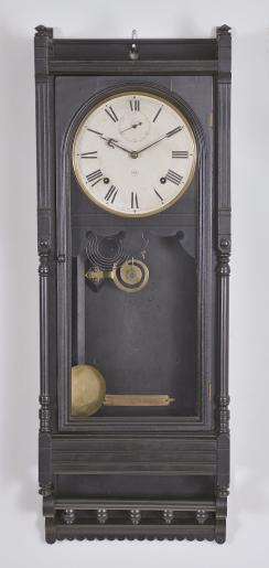 Clocks- 2 (Two) miniature wall: (1) A.D. Mougin, Paris, France, and Edouard Serin, France for Berton, Paris, cartel clock, 8 day, time only, spring driven movement in a cast brass case with urn finial, roman numeral white enamel dial with pierced gilt hands, c1880; (2) Probably Austrian, miniature wall clock, 2 day, time only, spring driven movement with silk thread suspension in a drop dial case with "H. Norton / London" painted on the lower portion, roman numeral white enamel dial and brass hands.