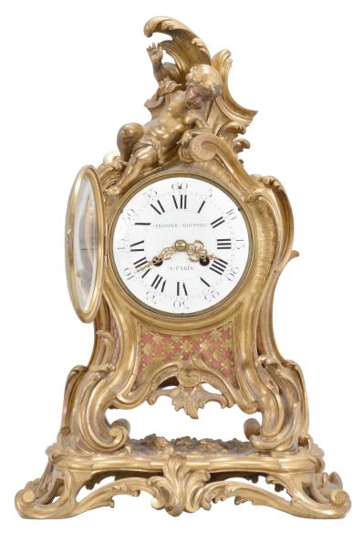 Vincenti & Cie, Paris, France, for Prosper Roussel, Paris, 8 day, time and strike, spring driven pendule de Paris movement in a gilt brass rococo style case topped by a reclining child figure, white enamel dial signed "PROSPER ROUSSEL / A PARIS", Louis XV style gilt hands.