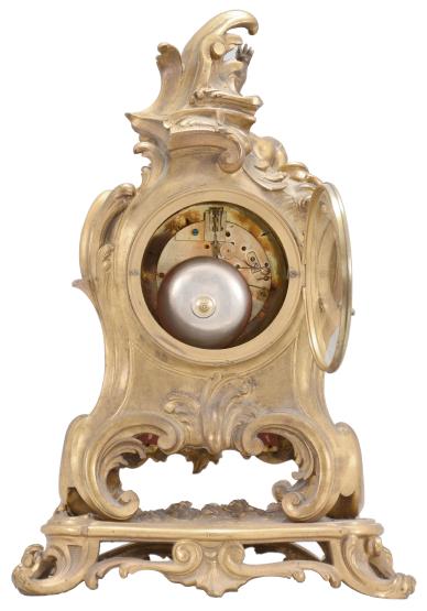 Vincenti & Cie, Paris, France, for Prosper Roussel, Paris, 8 day, time and strike, spring driven pendule de Paris movement in a gilt brass rococo style case topped by a reclining child figure, white enamel dial signed "PROSPER ROUSSEL / A PARIS", Louis XV style gilt hands.